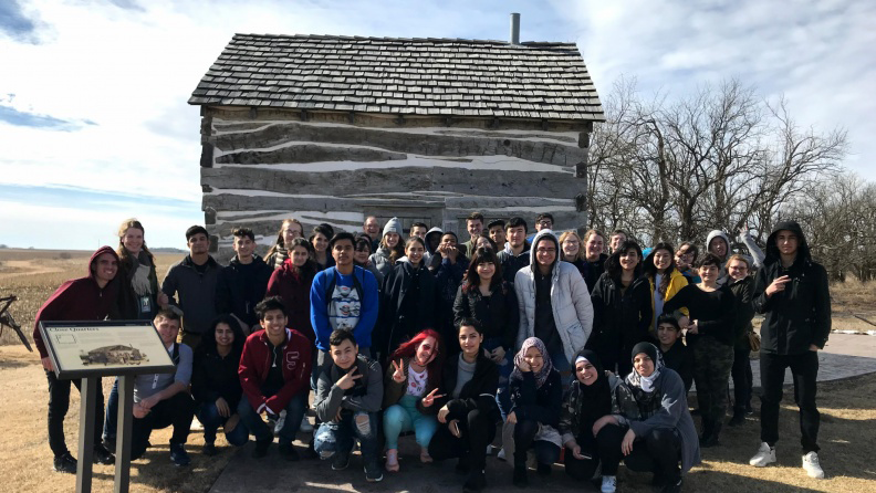 College and high school Husker Writers participants at Homestead National Monument; links to news story