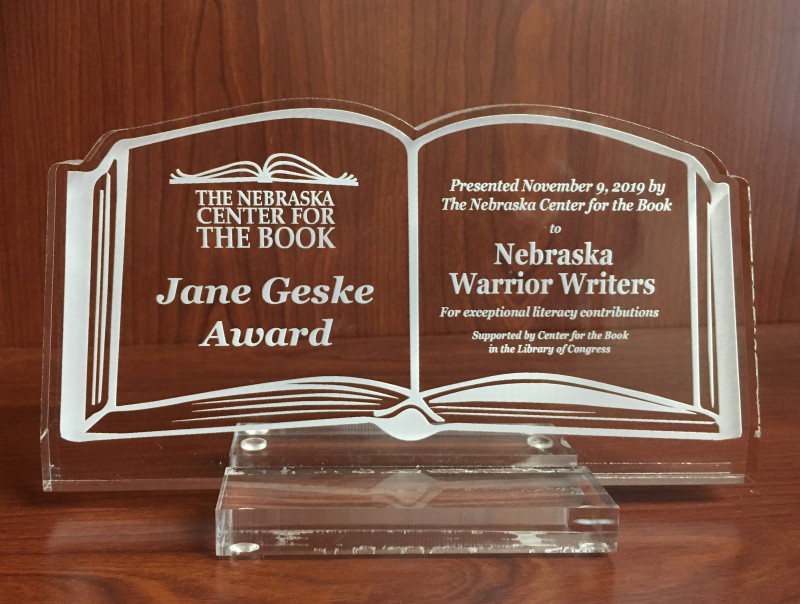 Jane Geske Award acrylic book; links to news story