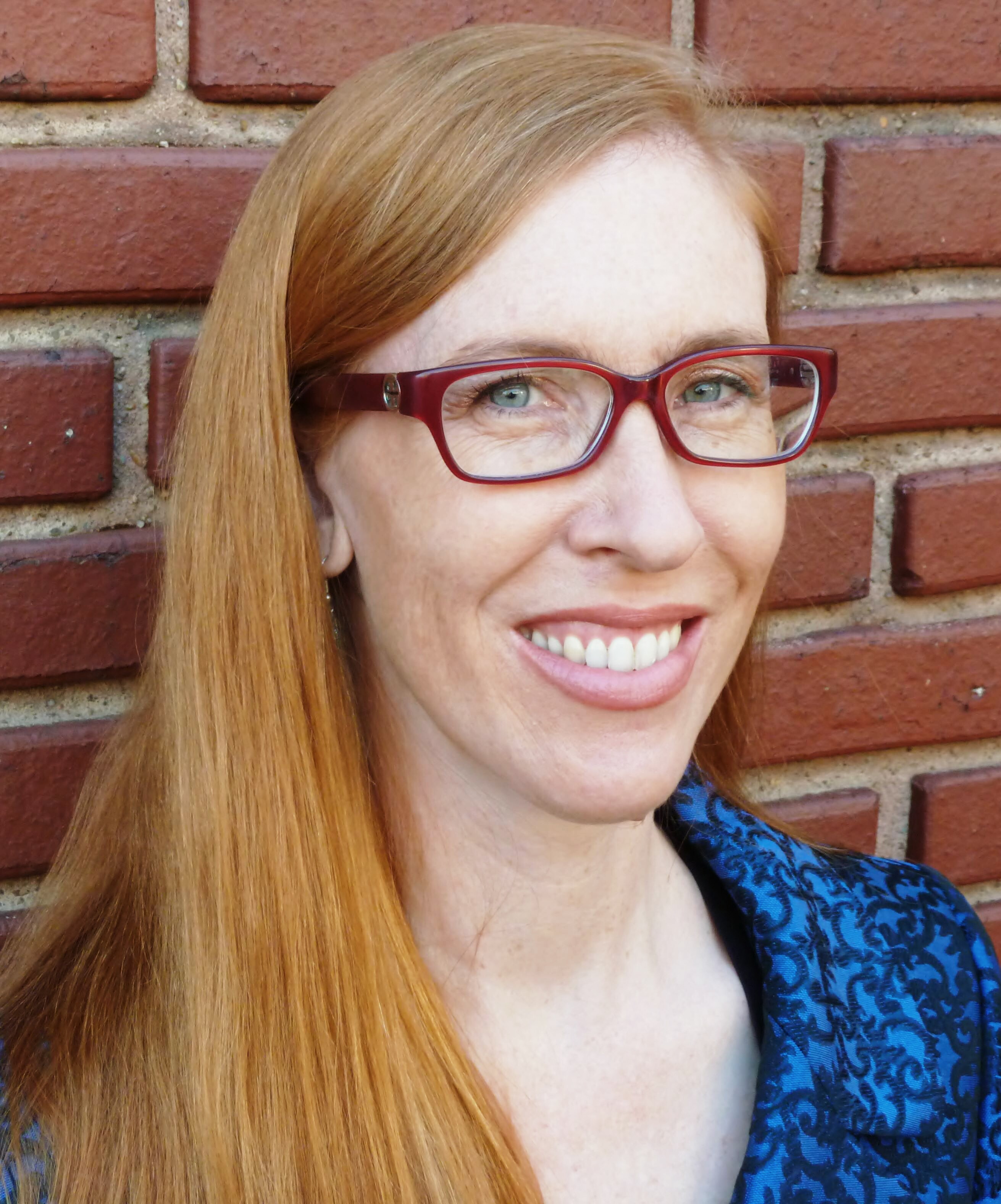 Photo of Julia Schleck; links to faculty profile