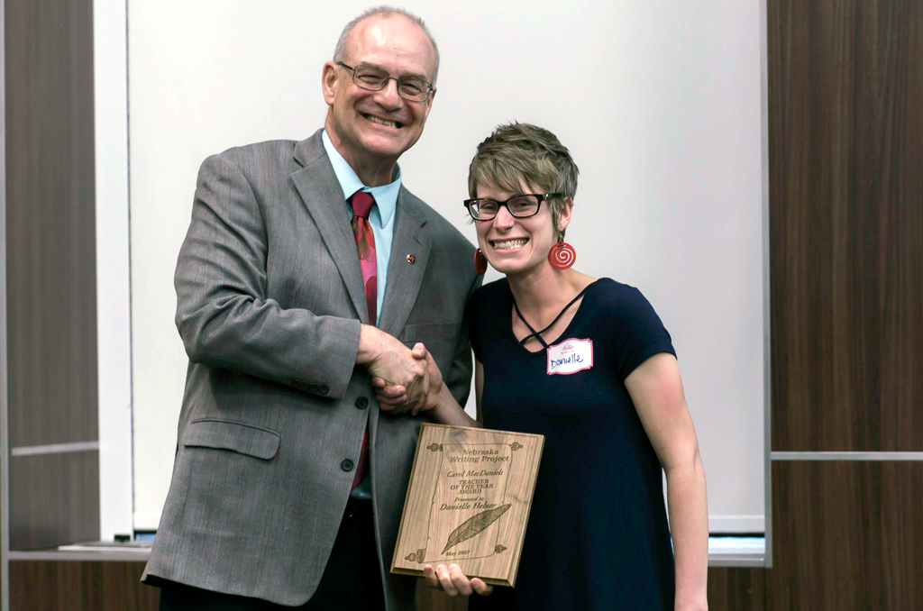Director Robert Brooke presents the award to Danielle Helzer at the 2017 Spring Gathering