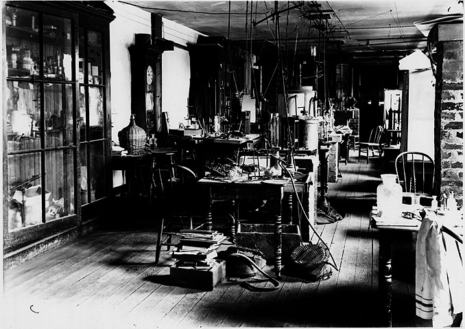 Early Twentieth Century laboratory with tables, chairs, and equipment.