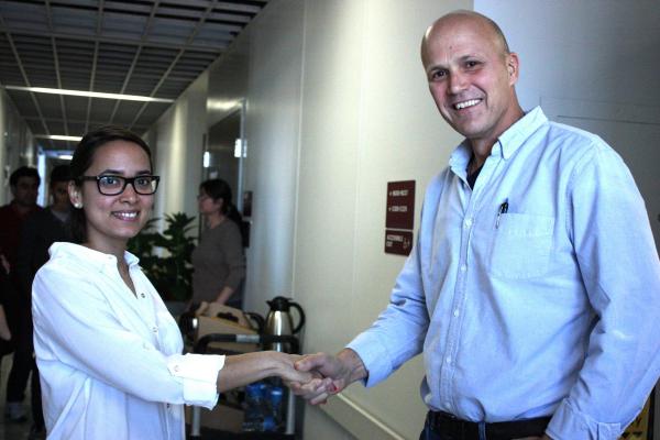 December, 2014. The “official” handshake between Jim Alfano and Tania Toruno marking a job well done by Tania in her PhD defense.
