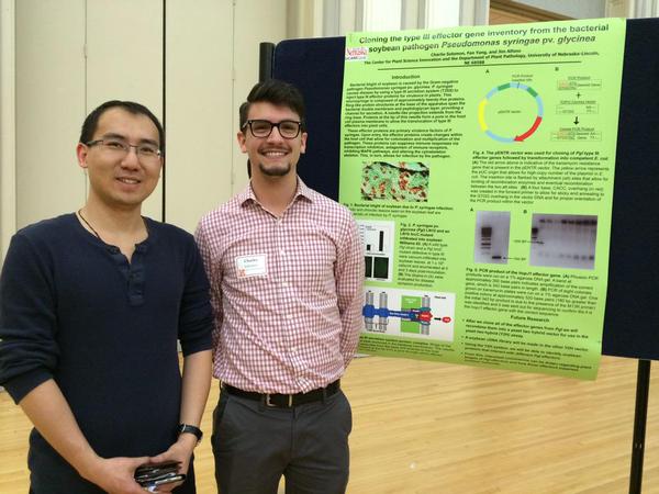 April, 2015. Undergrad Charlie Solomon with his lab mentor PhD student Fan Yang presenting his work at the UNL Research Fair.