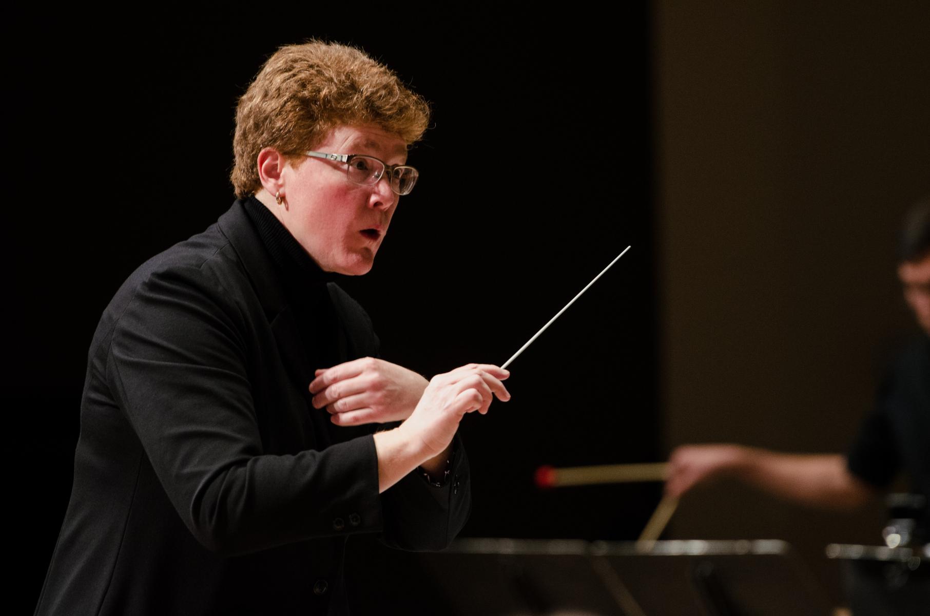 Photo of Dr. Carolyn Barber conducting the Wind Ensemble