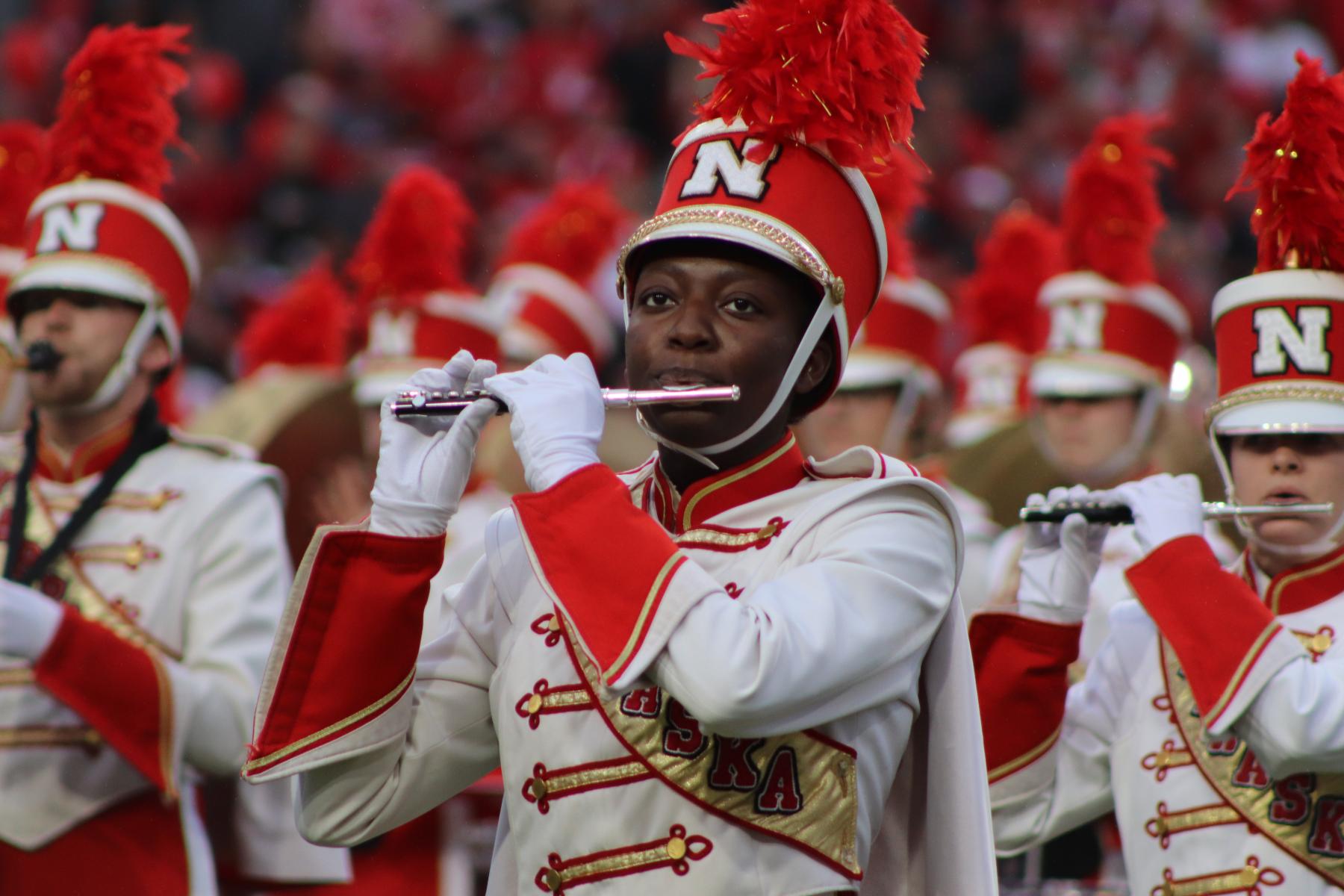Photo of Cornhusker Marching Band piccolo player at Memorial Stadium.