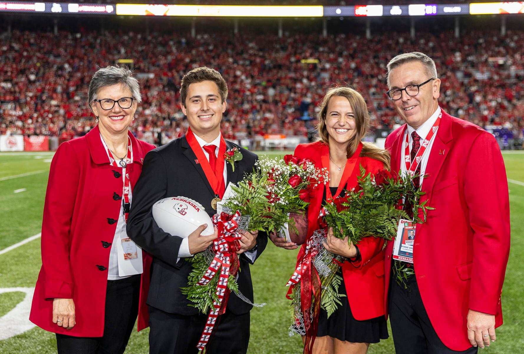 Chancellor Ronnie Green and his wife Jane with homecoming royalty