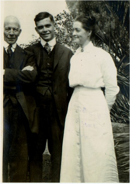 Two men in suits and woman in white outfit - possibly skirt and a long sleeved shirt 