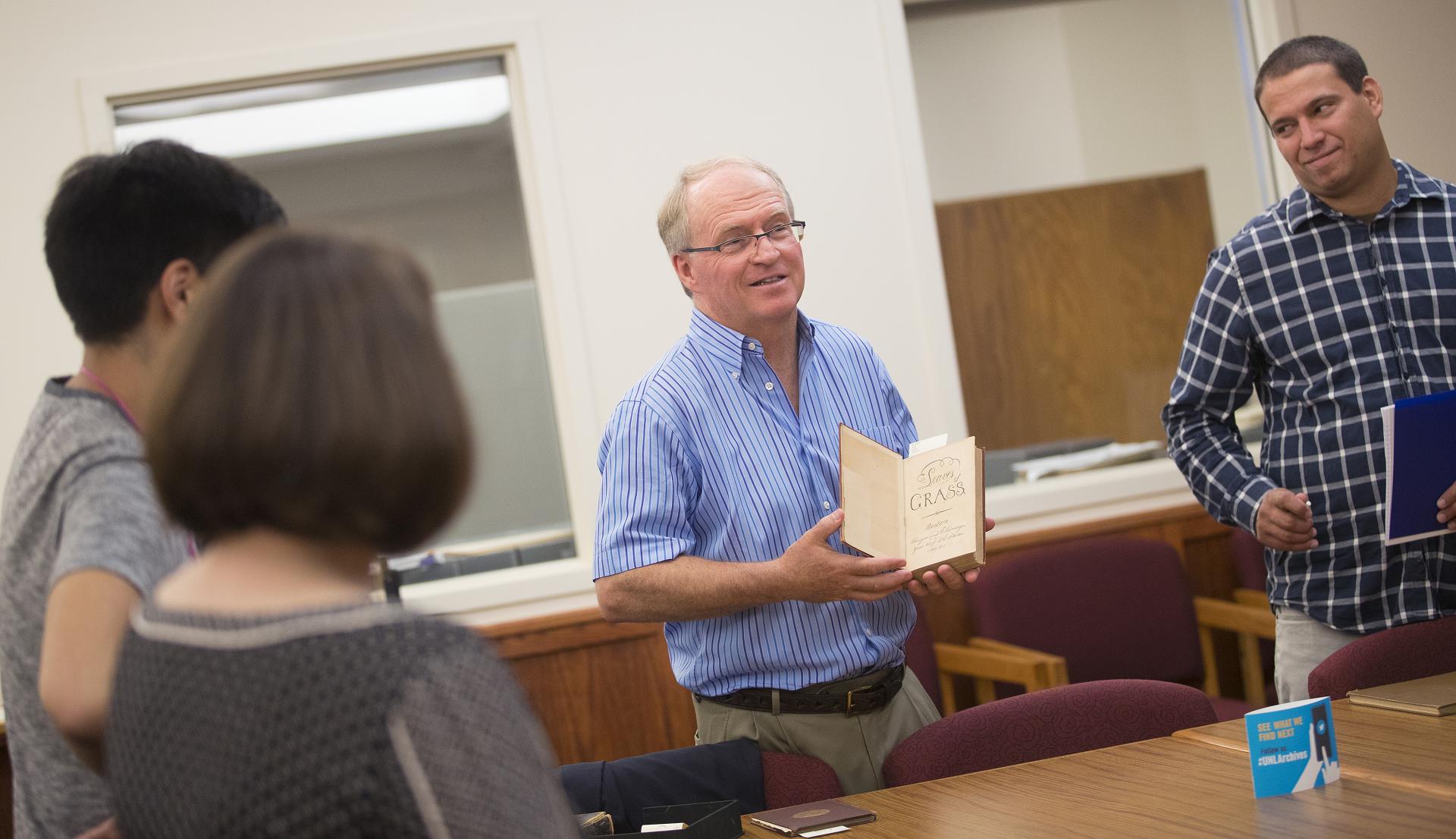 Professor Kenneth M. Price consults with students