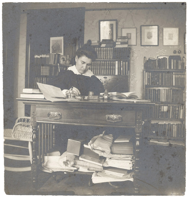 Willa Cather at a writing desk