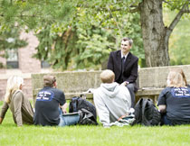 Dr. Derek Driedger leading a class outside on the Dakota Wesleyan University campus
