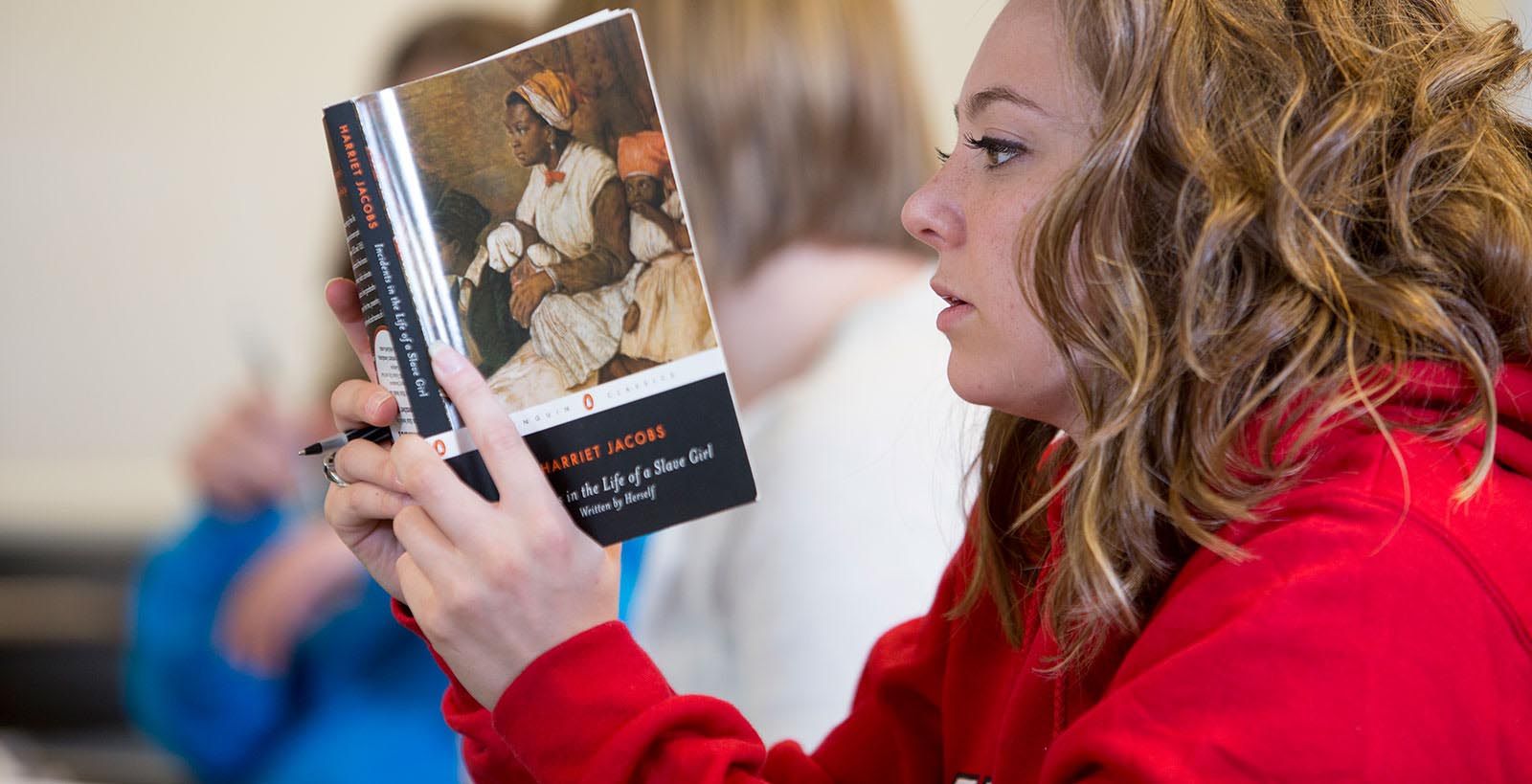 Student reading Incidents in the Life of a Slave Girl in one of Kwakiutl Dreher's classes