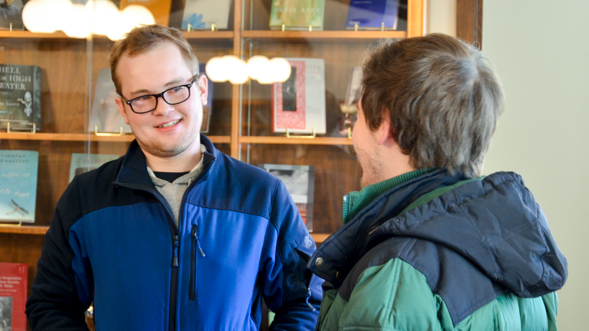 A student talks with recent graduate Colin Baker about majoring in Film Studies