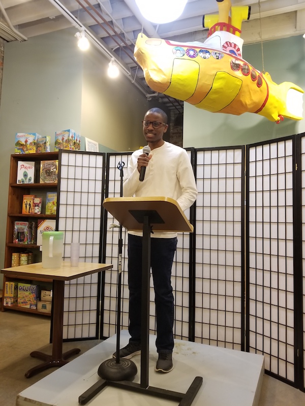 Jordan Charlton reads from his poetry at a No Name event