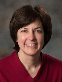 Photo of Debbie Minter; links to faculty profile