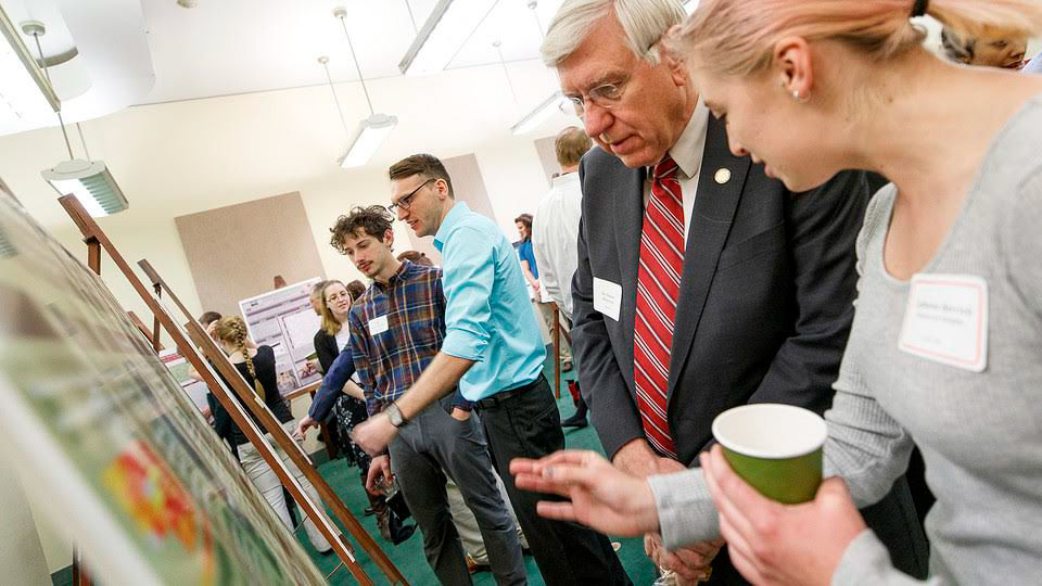 Research fair participants; links to news story