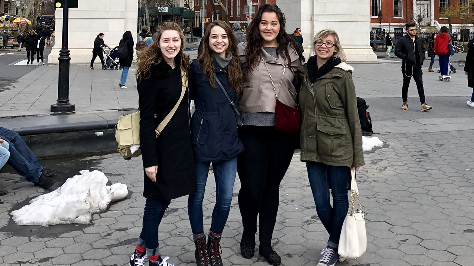 Araya Santo, Anika Eisenbraun, Abigail Godwin and Anika's sister, Nicole Eisenbraun, pose in Washington Square; links to news story