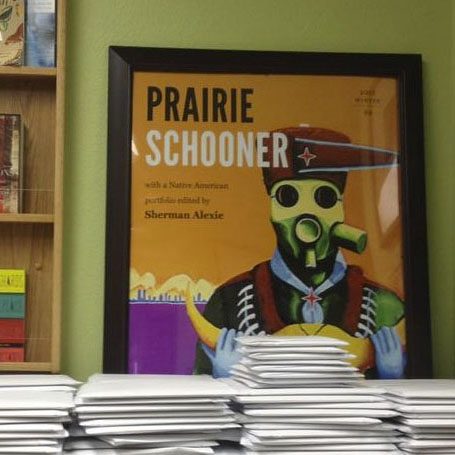 Photo of issues of Prairie Schooner in envelopes, ready for distribution; links to Prairie Schooner website