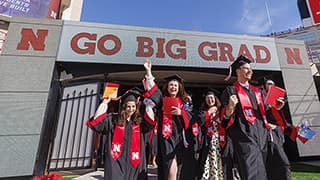 Students enter Memorial Stadium through the tunnel walk to find their seats for Undergraduate Commencement.