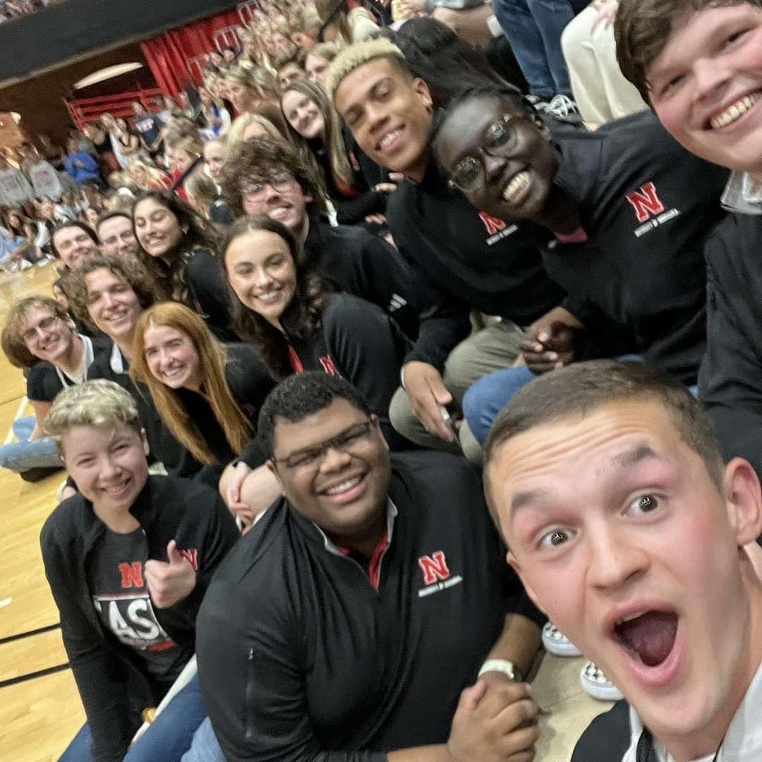 A group of students take a selfie.