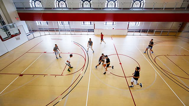 Overhead view of students playing basketball in the East Campus Recreation Center.
