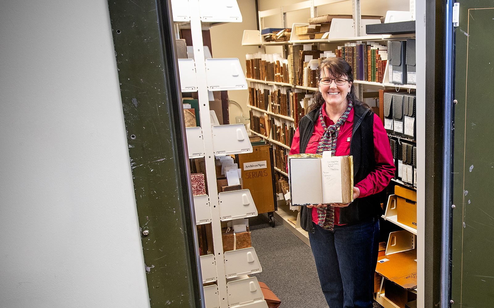 Mary Ellen Ducey in the archives library