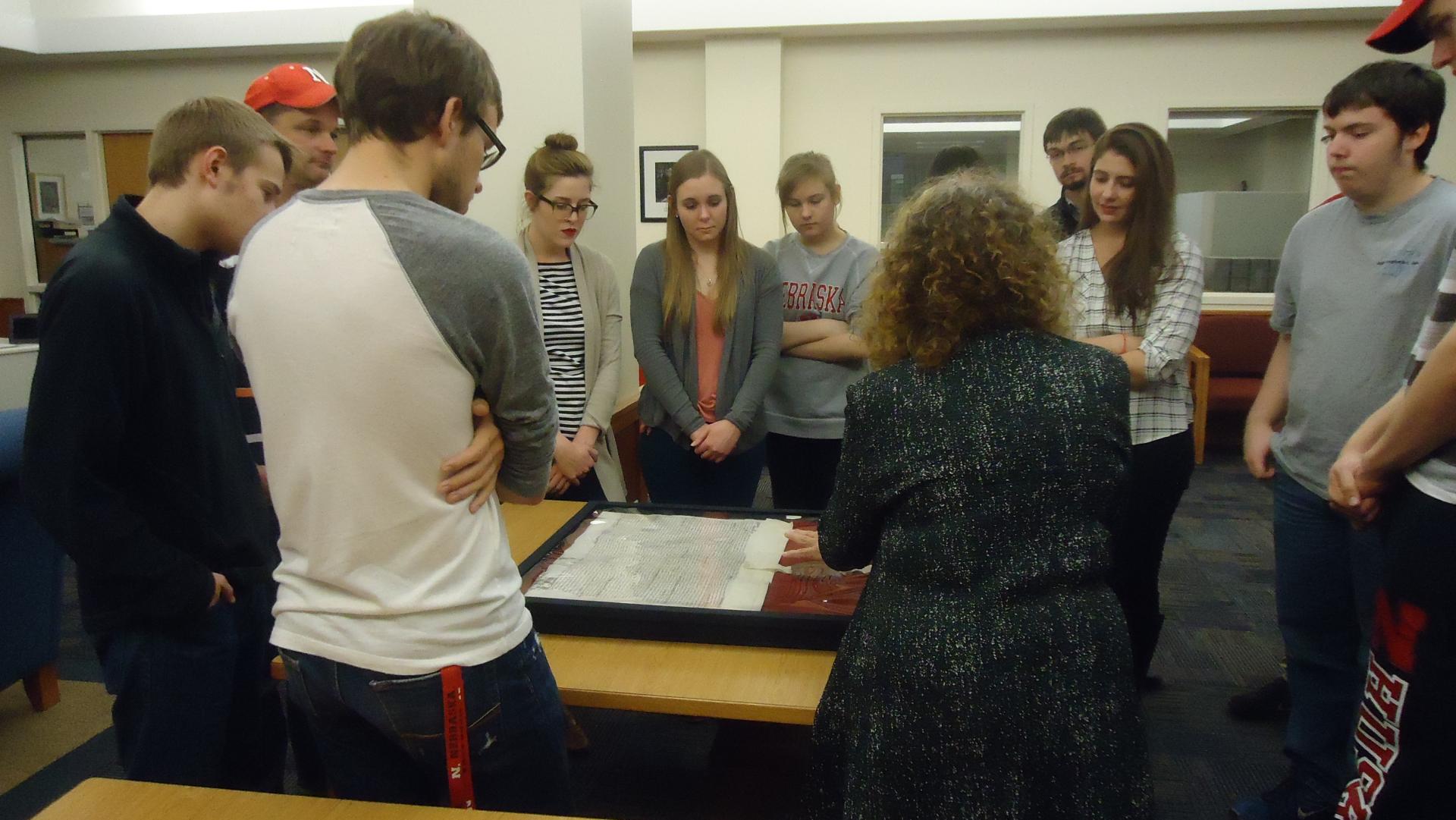 students view manuscript with Queen Elizabeth's seal