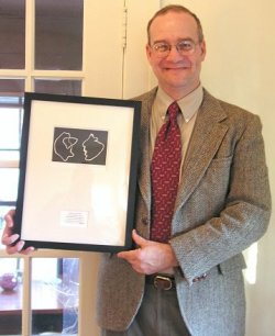 Robert Brooke holding Geske Award plaque