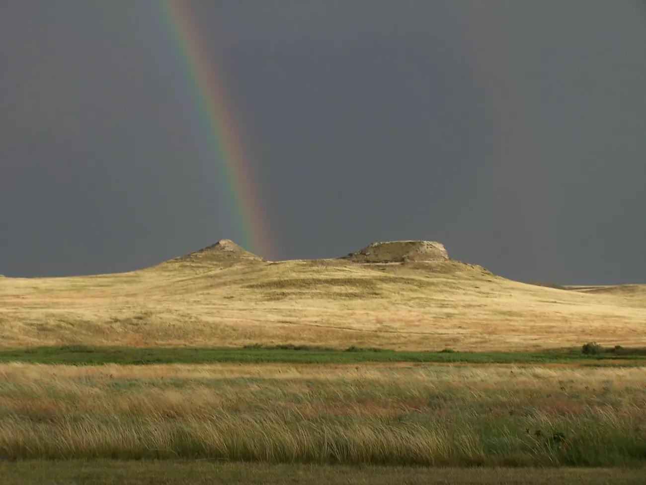 Double rainbow and storm clouds over the sandhills at Agate Fossil Beds