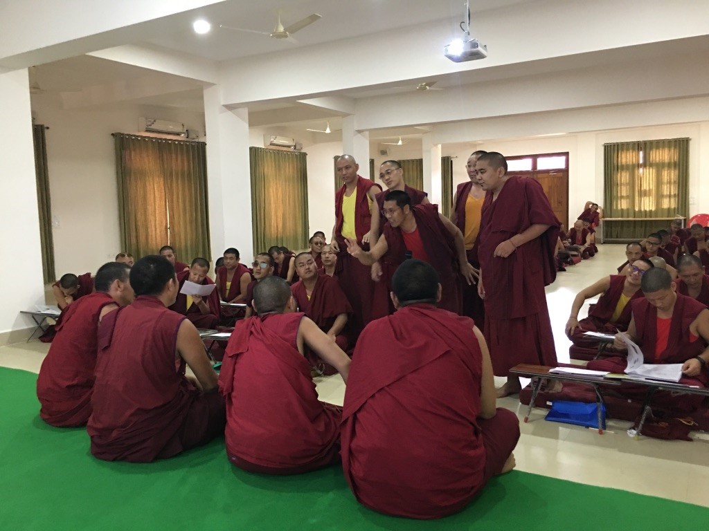 Tibetan monks debating in a classroom