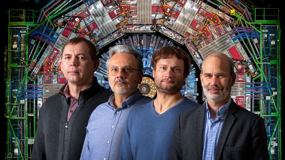 Ken Bloom and colleagues Ilya Kravchenko, Daniel Claes and Frank Golf in front of CERN Hadron Collider