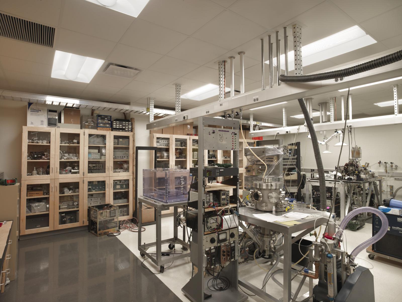 Lab interior with instruments on the table and in cabinets