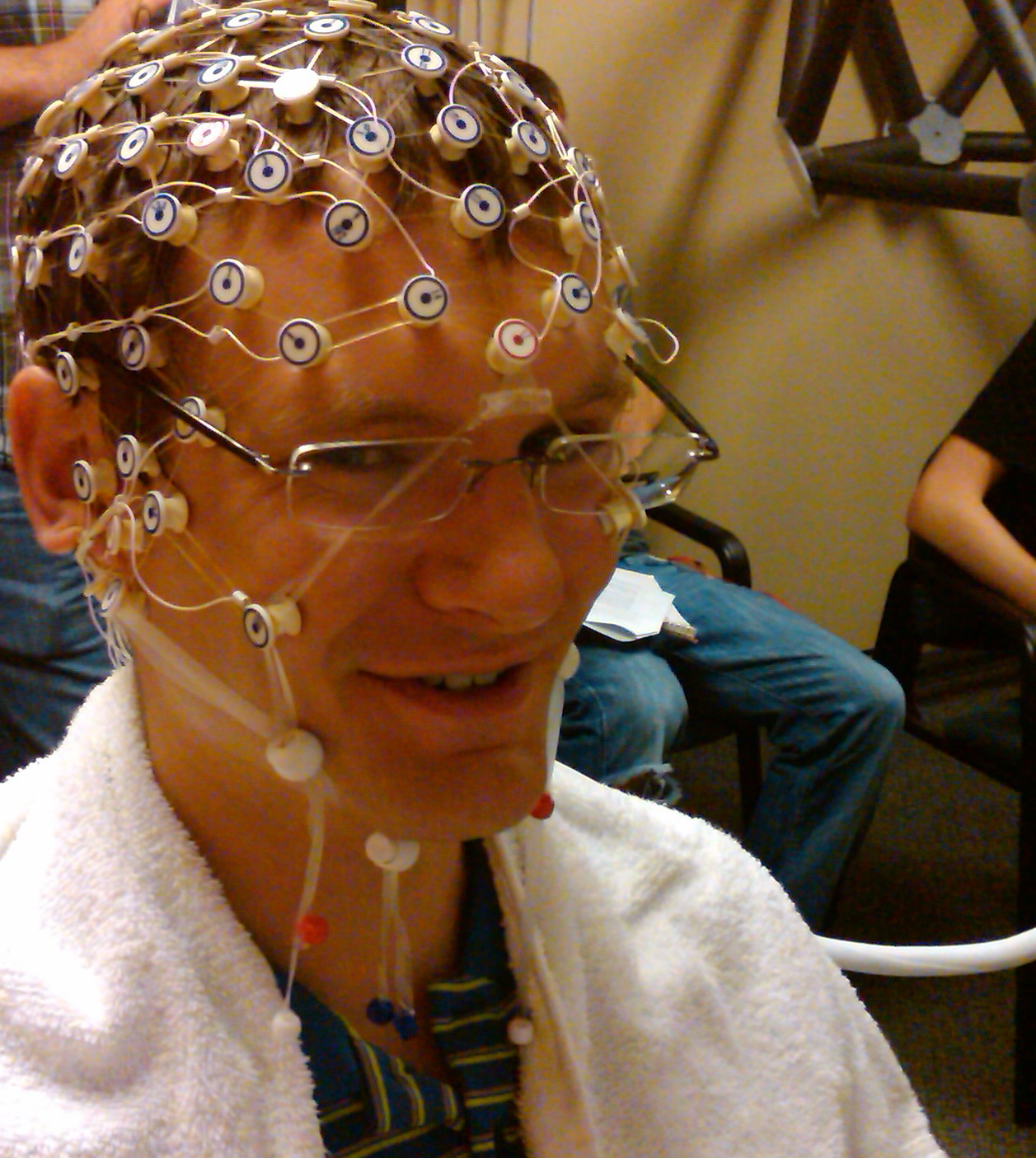 Man in lab with nodes on head