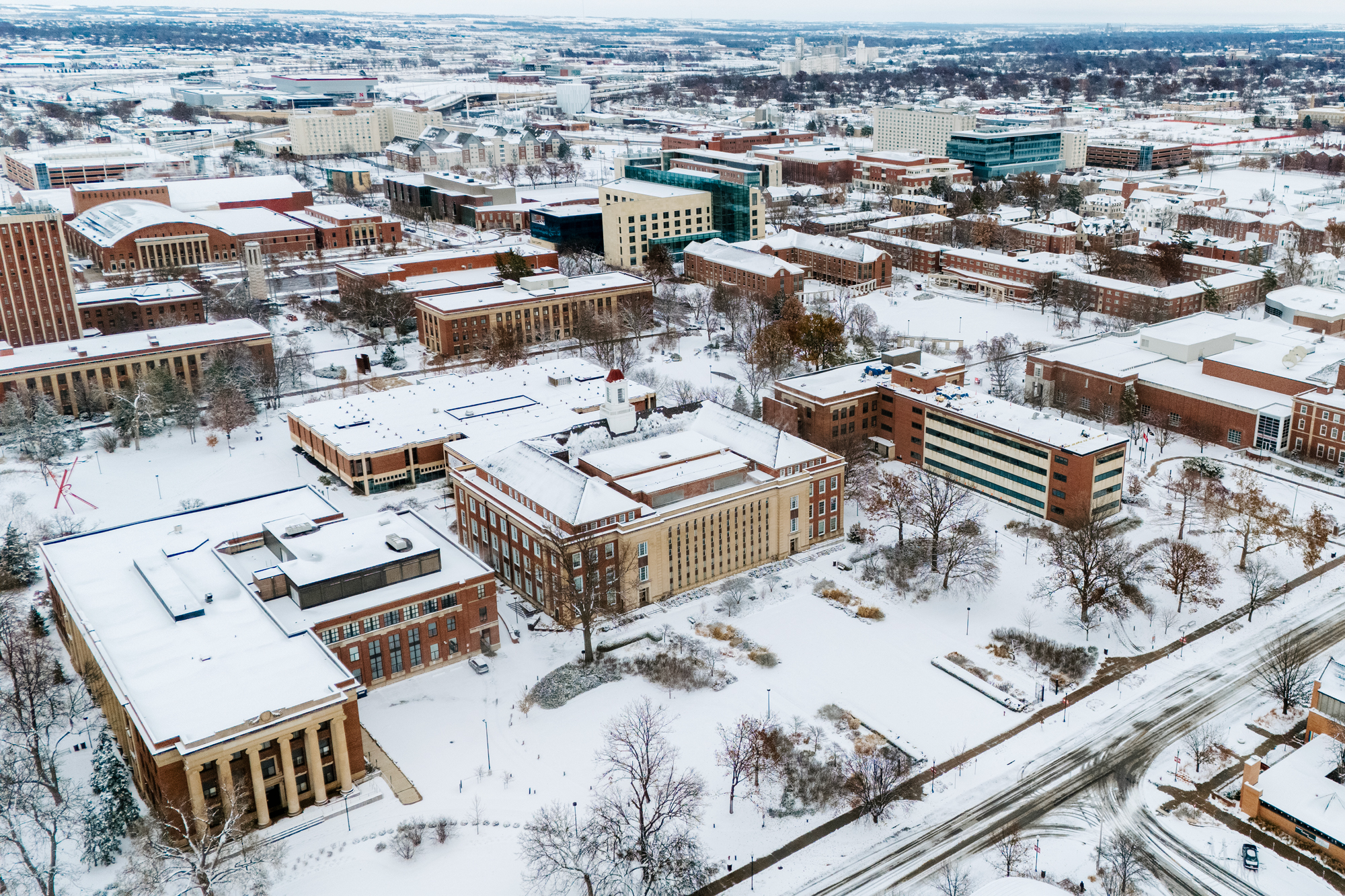 An aerial photo of city campus following a morning snowfall.