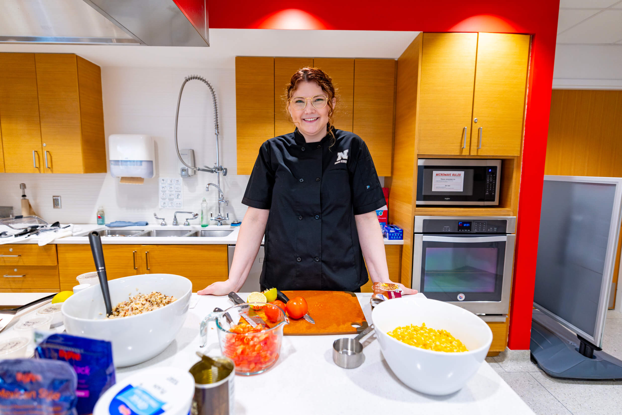 Ellyn McCarter, a Registered Dietitian/Nutrition Manager for the University’s Dining Service, poses for a photo at the University Health Center’s kitchen. McCarter spent the lunch hour demonstrating how to cook nutritious food with simple items for UNL’s faculty/staff.