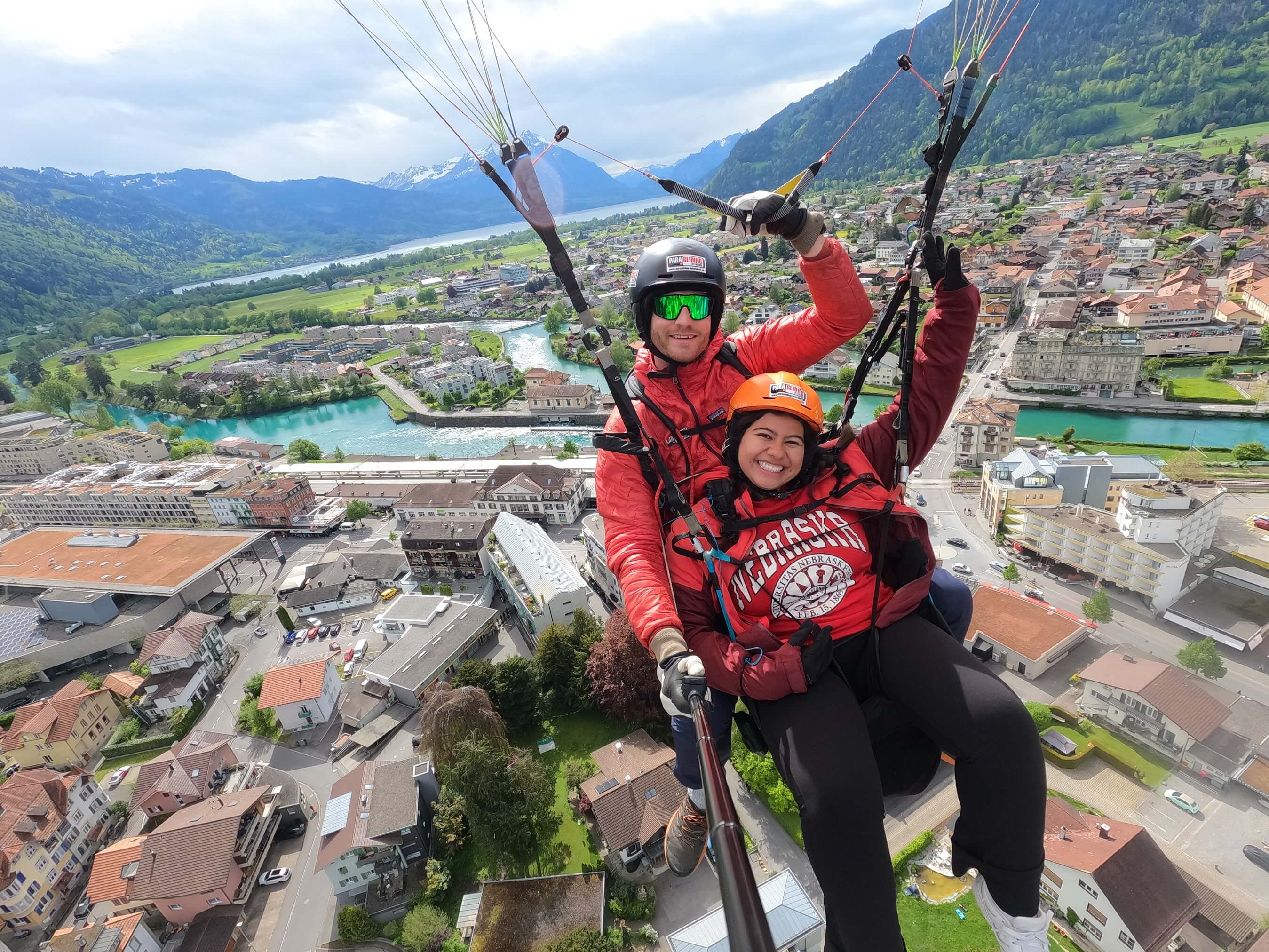 Jenny Castor smiles as she soars through the air with a skydiving instructor during a study abroad trip.