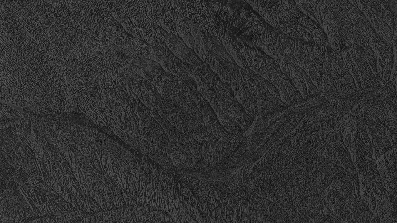 Dark, low contrast topographic map of Nebraska showing rivers and streams.