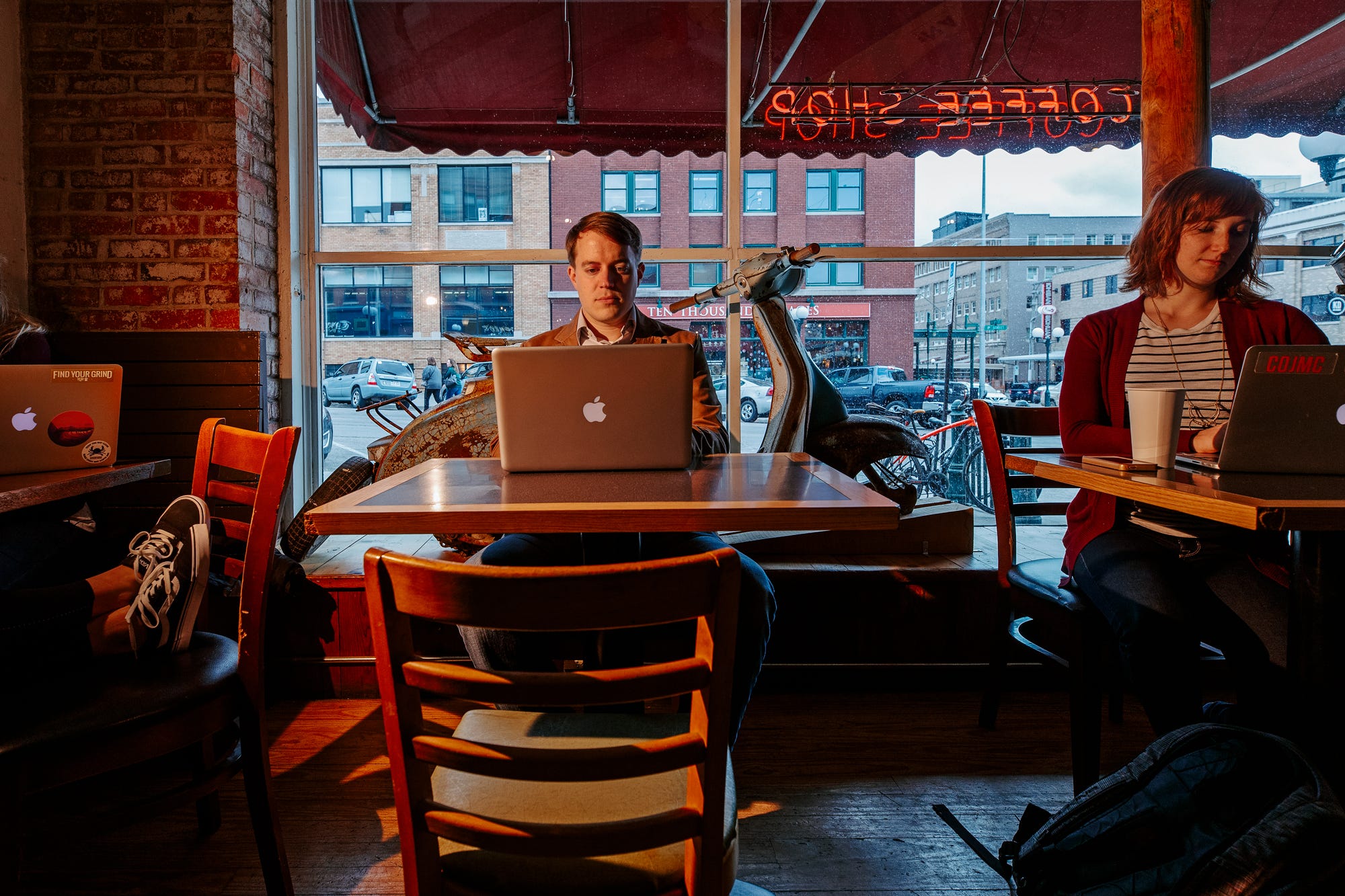 A student works on the computer in The Mill Coffee