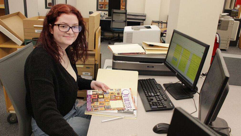 Kierra Dunnam, a sophomore majoring in history with minors in anthropology and queer studies, works during her internship with University Libraries Archives & Special Collections Kierra Dunnam, a sophomore majoring in history with minors in anthropology and queer studies, works during her internship with University Libraries Archives & Special Collections