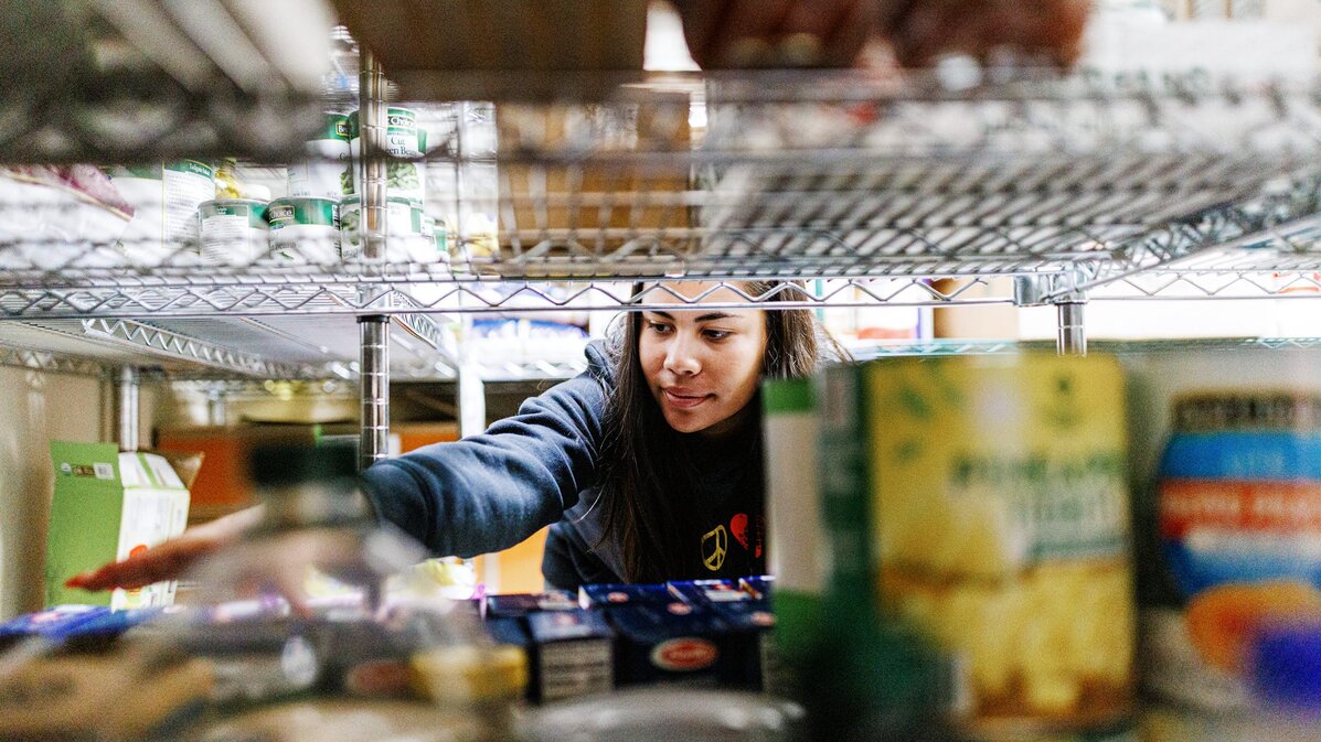 Bree Bell sorts boxes of food at Matt Talbot.