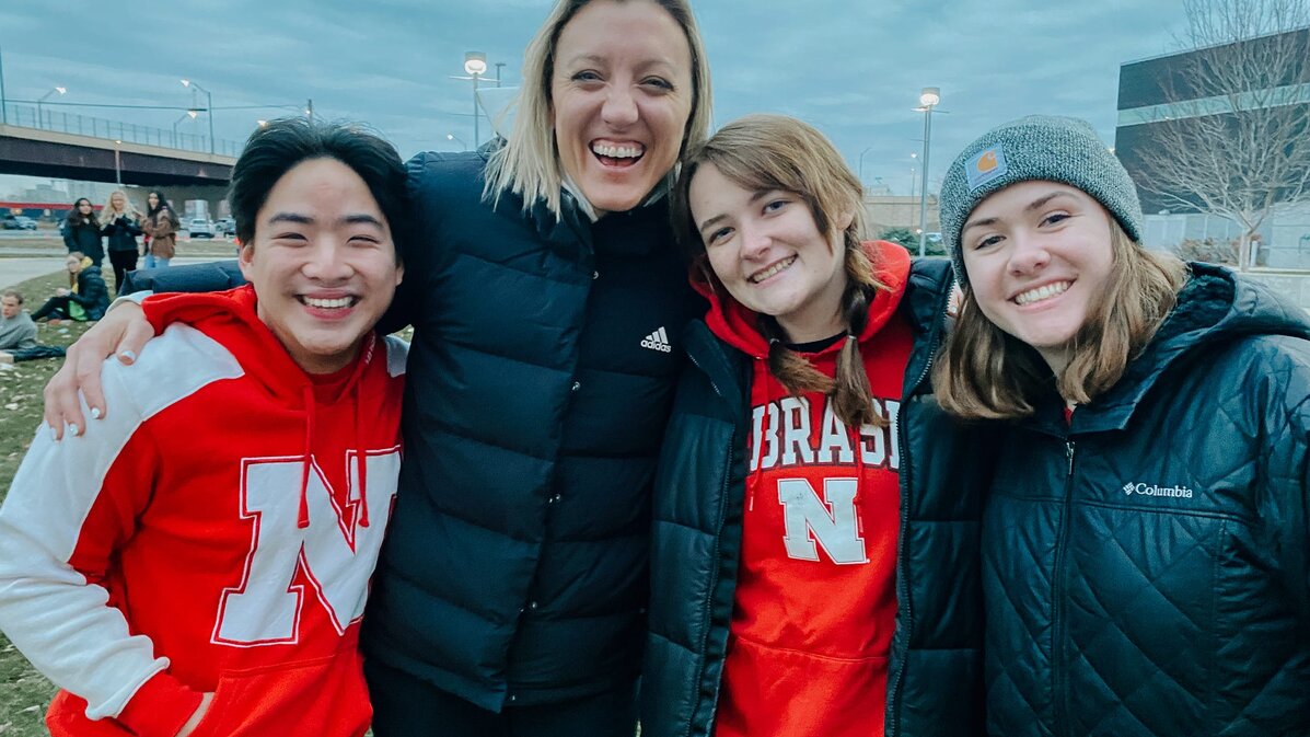 Carly (right) and friends take a photo with former Husker Volleyball player and Olympian Jordan Larsen.