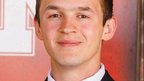 Phoenix smiles for a headshot as part of homecoming royalty