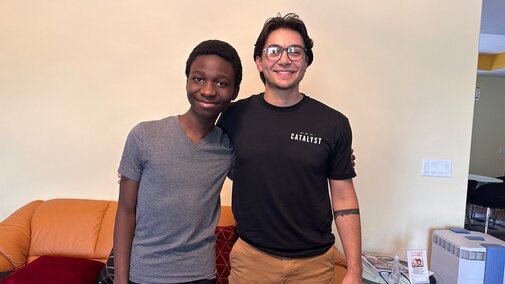 Brandon (right) and Jeffrey, his mentee, smile for a photo