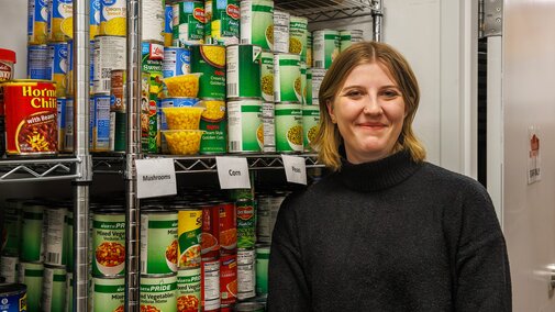Kaitlyn Richards smiles for a photo in the Husker Pantry