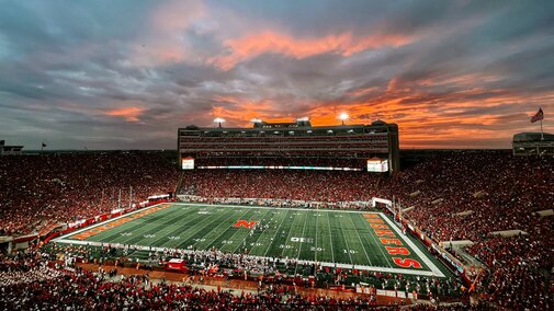 The sun sets during a sold-out Husker Football game