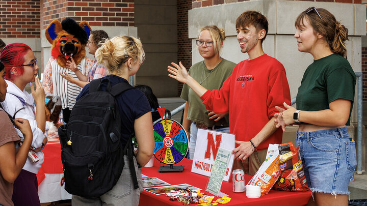Members of the Horticulture Club talk with fellow students and hand out plants during the NVolvement Fair on Aug. 27.