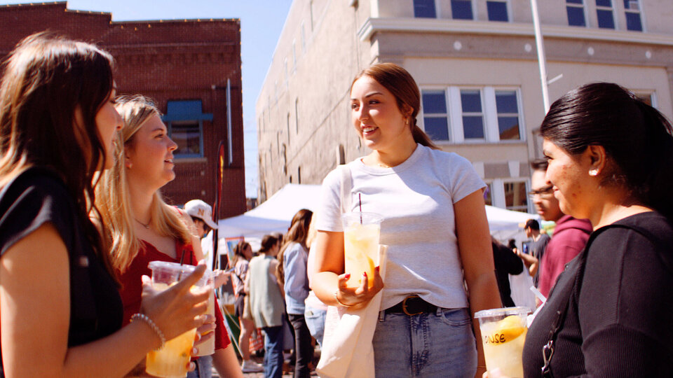 Students standing in Haymarket area of Lincoln talking