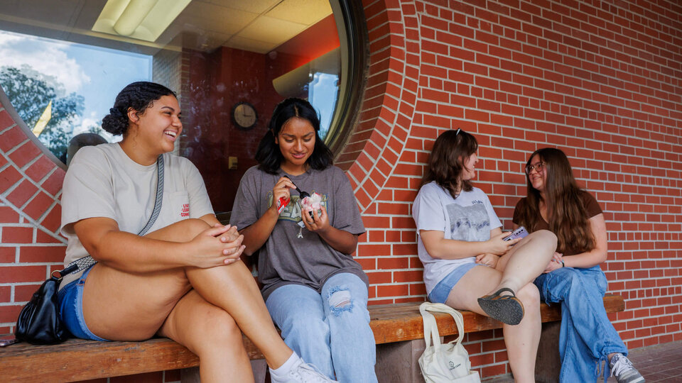 Students sitting outside Dairy Store