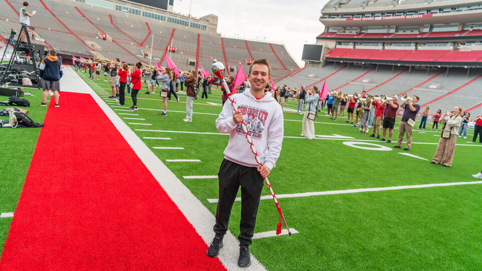 Student standing on Memorial Field during Marching Band practices