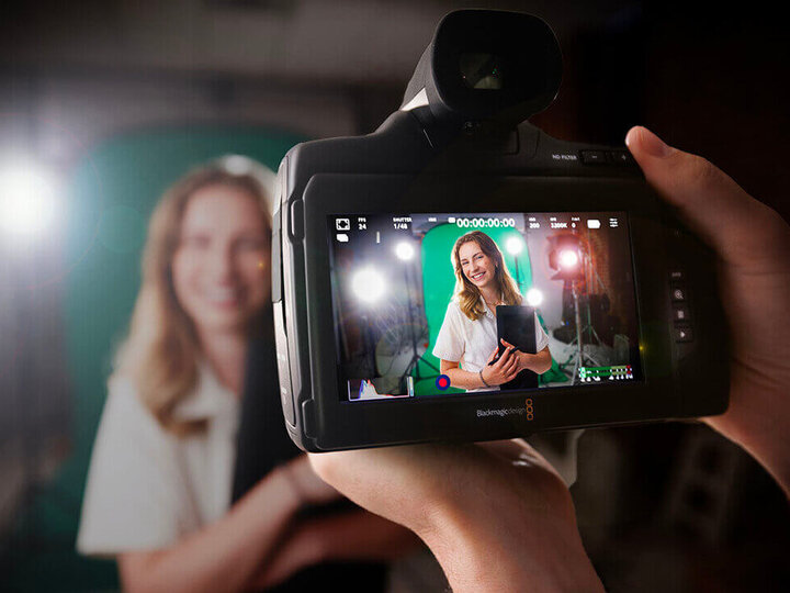 Student viewed through screen of camera