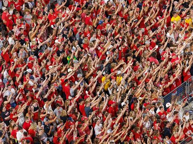 Overhead angle of Husker fans celebrating a point